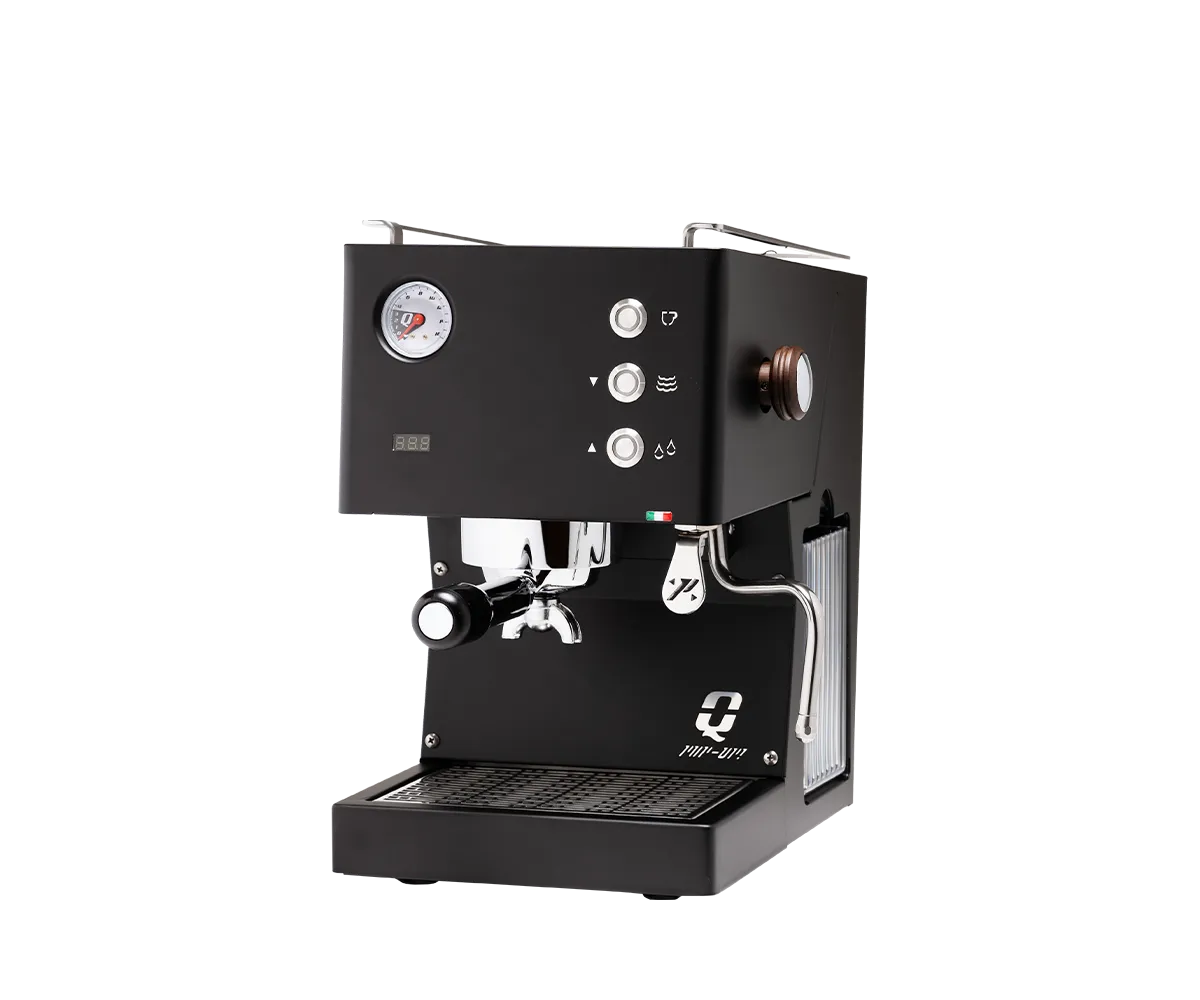 Quick Mill Pop Up espresso machine in matte black, shown from a front-right angle against a white background. The compact, rectangular machine features a pressure gauge, digital temperature display, three control buttons, chrome portafilter, stainless steel steam wand, cup-warming rails, and removable drip tray.